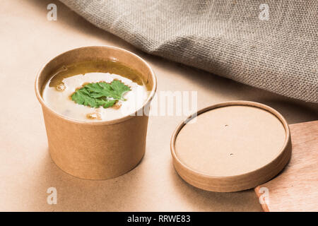 Soup in a disposable cup of craft paper Stock Photo
