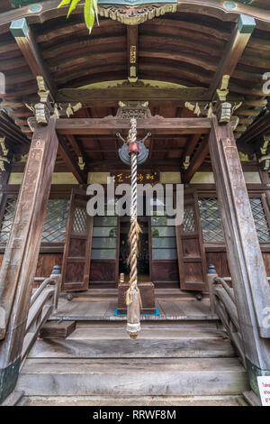 Yanaka, Tokyo, Japan - August 18, 2017 : Shrine housing wooden Bishamonten statue at Tennoji Temple of Tendai sect of Buddhism. Founded in 1274, locat Stock Photo