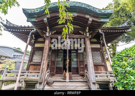 Yanaka, Tokyo, Japan - August 18, 2017 : Shrine housing wooden Bishamonten statue at Tennoji Temple of Tendai sect of Buddhism. Founded in 1274, locat Stock Photo