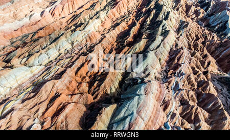 Top View of Rainbow Mountains Geological Park. Drone Photo Stripy Zhangye Danxia Landform Geological Park in Gansu Province, China on a Sunny Day. Stock Photo