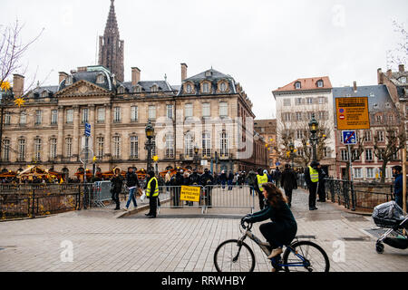 STRASBOURG, FRANCE - DEC 8, 2018: Police surveilling the entrance to Strasbourg Christmas Market in Strasbourg during winter holiday Stock Photo