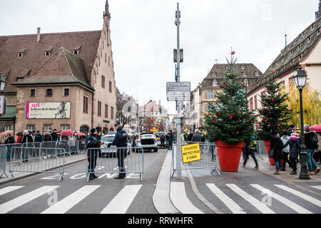 STRASBOURG, FRANCE - DEC 8, 2018: Police surveilling the entrance to Strasbourg Christmas Market in Strasbourg during winter holiday - city center surveillance Stock Photo