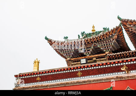 Wooden Traditional Chinese Roof Of Pagoda. Roof Structure Of Buddhist Temple. Oriental Architecture Of Kumbum Monastery in Xining. Stock Photo