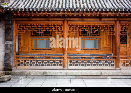 Traditional Wooden Chinese Architecture Of One Storie House. Courtyard Of A Renovated Oriental Building. Carved Details Of Timber. Stock Photo