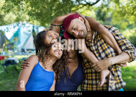 Portrait happy, carefree family at campsite Stock Photo