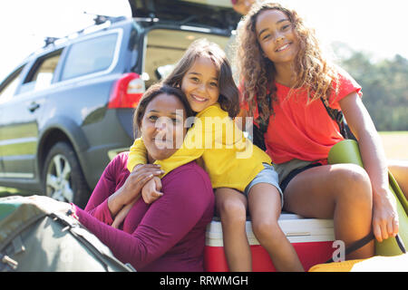 Portrait happy mother and daughters camping Stock Photo