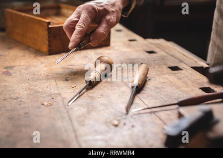 Rustic workbench with carving tools Stock Photo