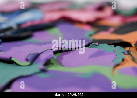Red background with fingerprints made from plasticine. Stock Photo
