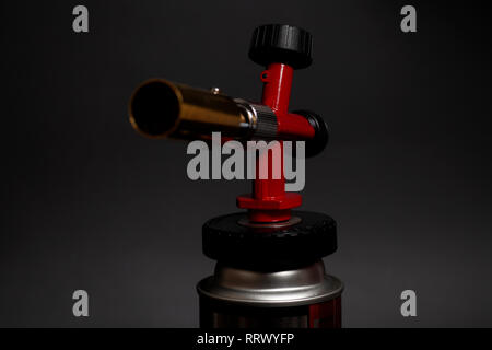 Manual gas burner isolated on black background Stock Photo
