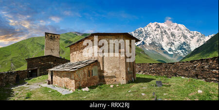 The medieval Georgian Orthodox St George Church “JGRag” with mount Shkhara (5193m) behind, Ushguli, Upper Svaneti, Samegrelo-Zemo Svaneti, Mestia, Geo Stock Photo