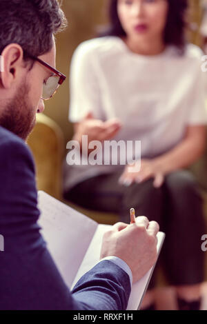 Selective focus of a doctor taking notes Stock Photo