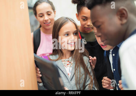 Junior high students using digital tablet Stock Photo