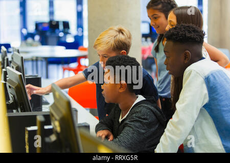 Junior high students using computer in computer lab Stock Photo