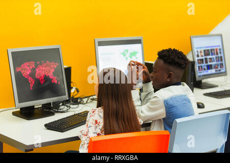 Junior high students using computer in computer lab Stock Photo