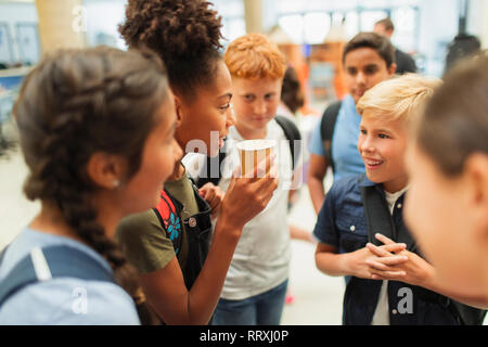 Junior high students hanging out, talking Stock Photo