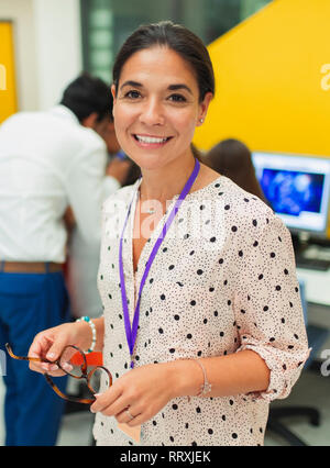 Portrait smiling, confident female teacher Stock Photo