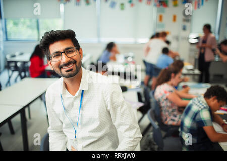 Portrait smiling, confident male teacher in classroom Stock Photo