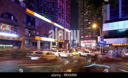 Chongqing, China - October 02, 2017: Long exposure picture of a street in downtown Chongqing at night. Stock Photo