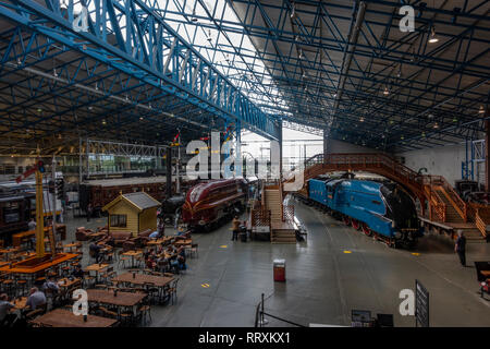 General view of the Main Hall featuring the Mallard (blue Loco on the right), National Railway Museum, York, UK. Stock Photo