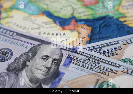 US dollars on the map of Saudi Arabia. American investment and trading with the Persian Gulf countries, arabian economy, oil industry Stock Photo