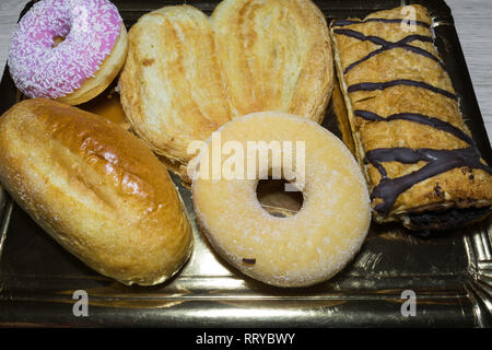 Variety of fresh bakery products in a tray Stock Photo