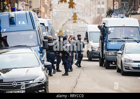 STRASBOURG, FRANCE - DEC 11, 2018: Police French vans and Police officers securing Place Gutenberg square near crime scene after an attack in the Strasbourg Christmas market area Stock Photo