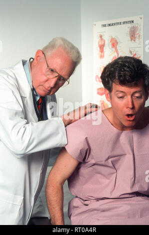1992, Family Doctor examining Middle Aged Male Patient, USA Stock Photo