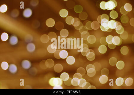 Abstract background with bokeh in gold color tone Stock Photo