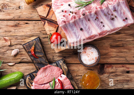 Fresh meat.Raw meat.Different types of raw meat on a wooden background Stock Photo