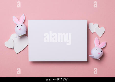Happy Easter letter. white card with rabbits and hearts mock up Stock Photo