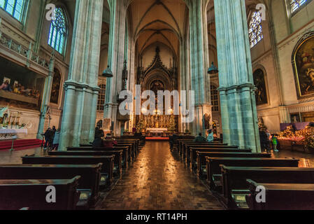 Vienna, Austria - December 24, 2017. Inner view of Minoritenkirche or Church of Mary of the Snows built in gothic architecture style. Medieval Maria S Stock Photo