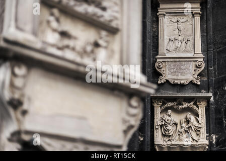 Vienna, Austria - December 30, 2017. Exterior decorative details of gothic St. Stephen's Cathedral. Facade wall bas-relies sculptures depicts crucifie Stock Photo