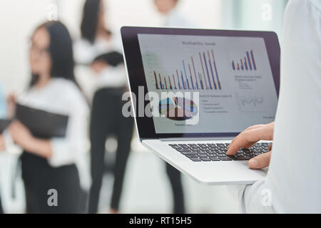 close up. the businessman uses a laptop to analyze financial data Stock Photo