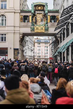 Vienna, Austria - December 30, 2017. Tourist crowd in front of famous Anker Clock chimes on Hoher Markt. Oldest square in Vienna and people waiting fo Stock Photo
