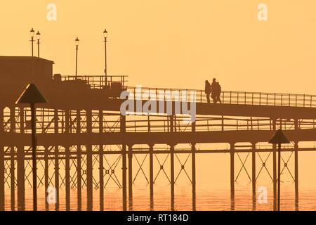 Southend-on-sea, Essex, UK. 27th February, 2019. UK Weather: Sunrise over Southend-on-sea - view looking towards the pier Credit: Ben Rector/Alamy Live News Stock Photo