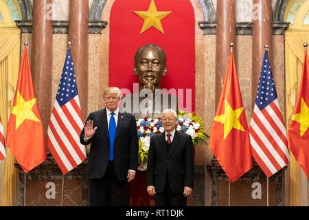 Hanoi, Vietnam. 26th Feb, 2019. U.S President Donald Trump and Vietnamese President Nguyen Phu Trong stand together prior to their meeting in the Mirror Room of the Presidential Palace February 27, 2019 in Hanoi, Vietnam. Credit: Planetpix/Alamy Live News Stock Photo