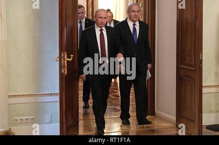Moscow, Russia. 27th Feb, 2019. Russian President Vladimir Putin escorts Israeli Prime Minister Benjamin Netanyahu prior to their bilateral meeting at the Kremlin February 27, 2019 in Moscow, Russia. Credit: Planetpix/Alamy Live News Stock Photo