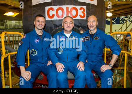 Baikonur, Kazakhstan. 27th Feb 2019. International Space Station Expedition 59 backup crew members talk with the media outside the Soyuz spacecraft at the Baikonur Cosmodrome February 27, 2019 in Baikonur, Kazakhstan. Left to right are: Drew Morgan of NASA, Alexander Skvortsov of Roscosmos and Luca Parmitano of the European Space Agency. Credit: Planetpix/Alamy Live News Stock Photo