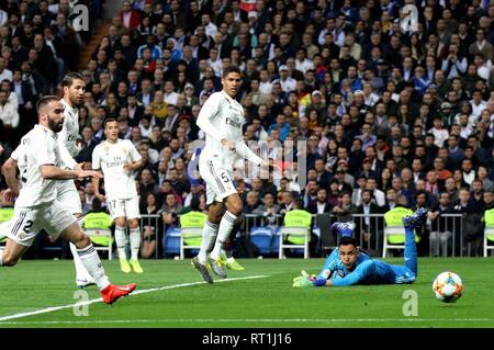 Madrid. 27th Feb, 2019. Real Madrid's goalkeeper Keylor Navas (1st R) competes during the Spanish King's Cup semifinal second leg soccer match between Real Madrid and Barcelona in Madrid, Spain on Feb. 27, 2019. Real Madrid lost 0-3. Credit: Edward F. Peters/Xinhua/Alamy Live News Stock Photo