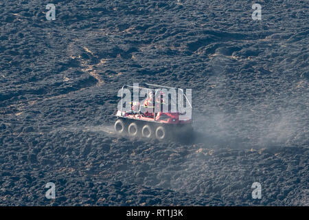 Marsden, Saddleworth, Yorkshire, UK. 27th Feb, 2019. Scorched moorland was still smouldering this afternoon following the dramatic fire overnight at Marsden Moor, near Saddleworth Moor. Firemen were using a special buggy to survey areas of ground still smouldering. Credit: James Copeland/Alamy Live News Stock Photo