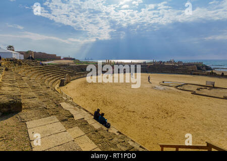 Caesarea, Israel - February 19, 2019: View of the Roman Amphitheater, with visitors, in Caesarea National Park, Northern Israel Stock Photo