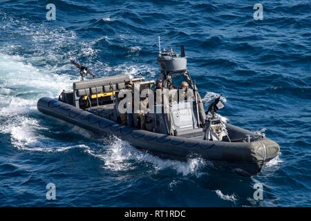 190224-N-NB544-1253 PACIFIC OCEAN (Feb. 24, 2019) A Marine Viper rigid hull inflatable boat transit alongside the San Antonio-class amphibious transport dock ship USS John P. Murtha (LPD 26) in preparation for a visit, board, search and seizure evolution. John P. Murtha is underway conducting routine operations as a part of USS Boxer Amphibious Ready Group (ARG) in the eastern Pacific Ocean. (U.S. Navy photo by Mass Communication Specialist 2nd Class Kyle Carlstrom) Stock Photo