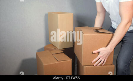 man takes a lot of cardboard Box Stock Photo