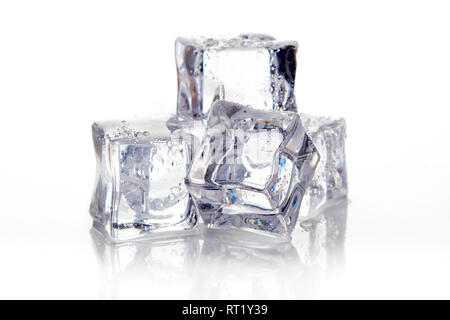 Wet square ice cubes isolated on white background Stock Photo