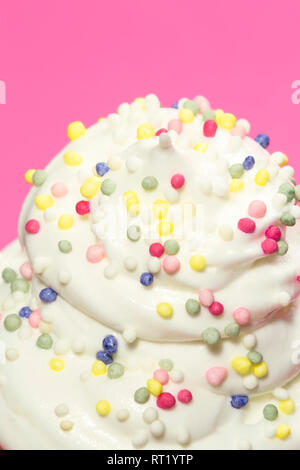 Whipped cream with the colorful sugar sprinkles Stock Photo
