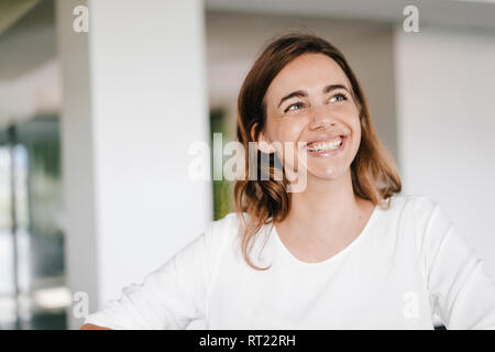 Portrait of a beaming young businesswoman Stock Photo