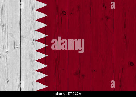 Qatar flag painted on old wood plank. Patriotic background. National flag of Qatar Stock Photo