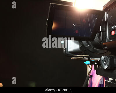 professional digital camera on a tripod during shooting, tv set Stock Photo