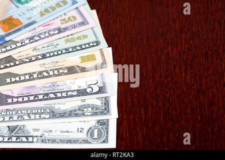 American dollars on a wooden background Stock Photo