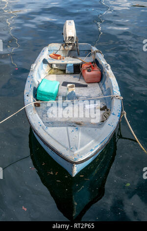 Old boat with an outboard motor moored at the pontoon Stock Photo - Alamy